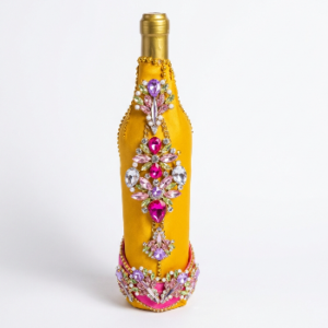 Orange decorative wine bottle in a high heel